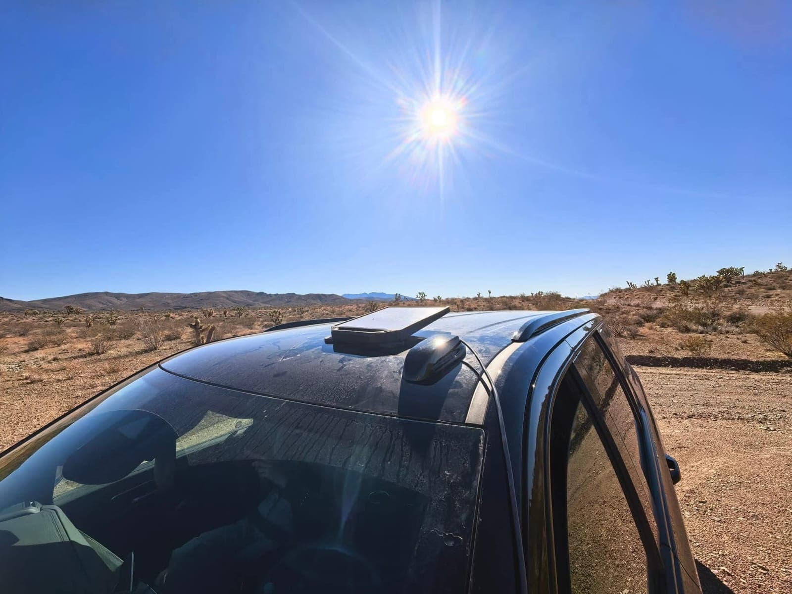 Starlink Mini on a vehicle roof in a remote area