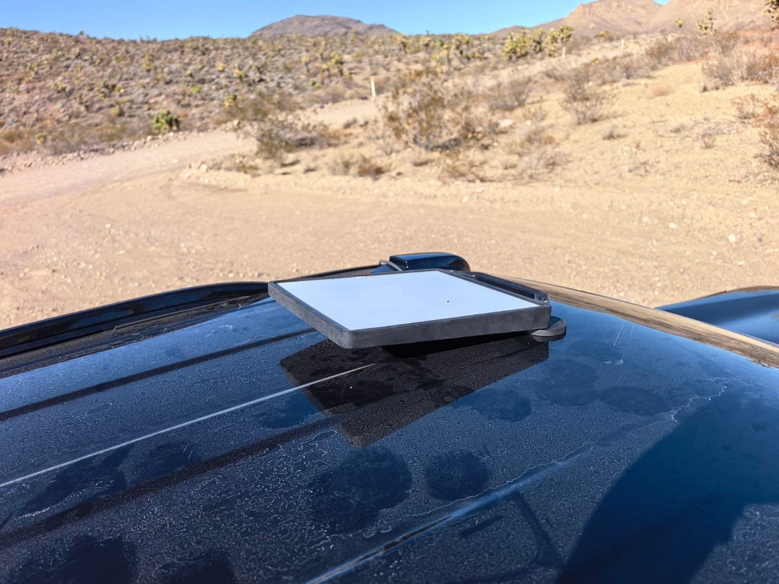 Close view of Starlink Mini mounted on a vehicle roof