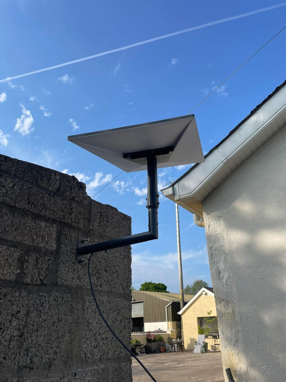 Starlink wall mount installation between two buildings